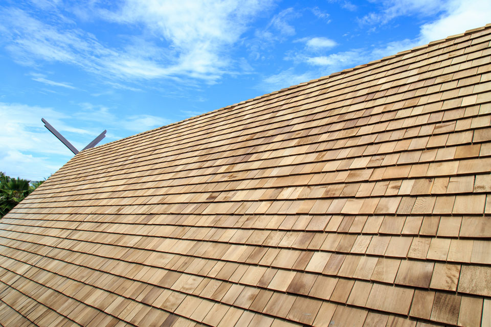 Natural wood shake roofing on a rustic-style home