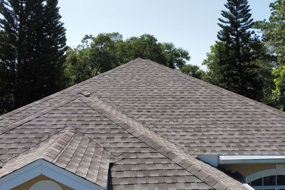 Asphalt shingle roofing on a suburban home